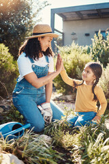 Family, children or high five with a mother and daughter gardening while planting plants together....