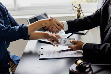 business people shaking hands and Give an under-the-table bribe to an attorney to help a lawyer win...