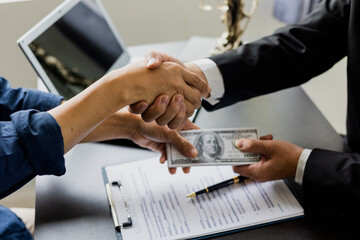 business people shaking hands and Give an under-the-table bribe to an attorney to help a lawyer win a court case. Bribery and Kickback Ideas Fraud and Fraud.