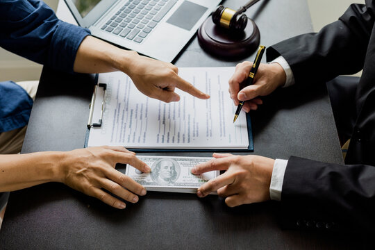 business people shaking hands and Give an under-the-table bribe to an attorney to help a lawyer win a court case. Bribery and Kickback Ideas Fraud and Fraud