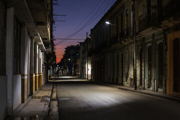 Naklejka na ściany i meble Quiet street in Havana just before sunrise.