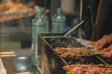 close up grill lamb on the Charcoal stove in street food stall at night market