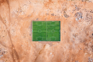 Sports field with players in the middle of the desert on Sal, Cape Verde Islands.