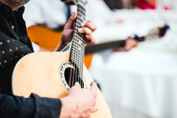Close up of the guitar of a man playing traditional Portuguese  fado