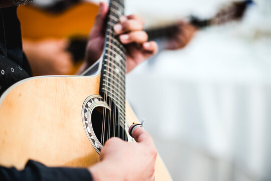 Close up of the guitar of a man playing traditional Portuguese  fado