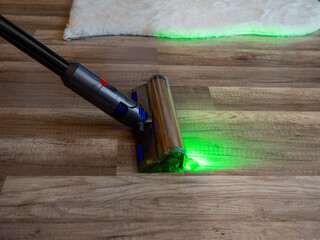Vacuumed with a modern vacuum cleaner. Cleaning of the apartment. Close-up.