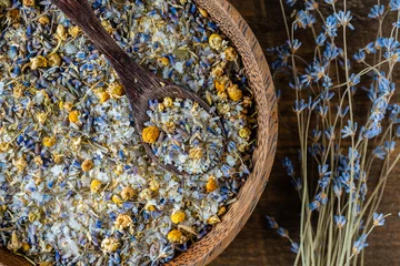 Fotobehang Sea himalayan salt with dry lavender and chamomile flowers , closeup, top view © OlegD