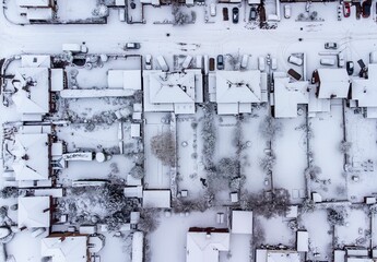 Aerial shot of residential houses covered in snow