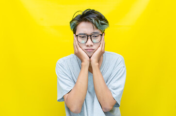 portrait of An Asian man has a stressed, glum, and messed-up appearance. a man who is angry and...