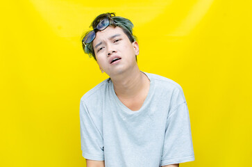 portrait of An Asian man has a stressed, glum, and messed-up appearance. a man who is angry and agitated. freaked out over work.