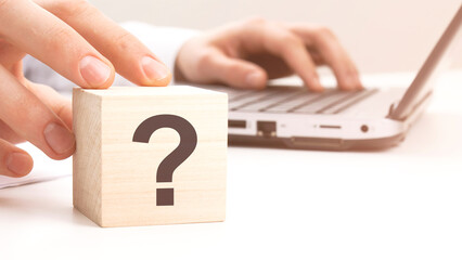 sign question on wooden block on white table background. Idea, strategy, advertising, marketing,...