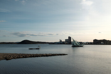 Beautiful "She Lies" public sculpture floating in the water in Oslo