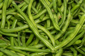 Fresh green beans pile background.