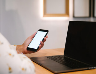 unrecognizable caucasian woman sitting in front of her considering work, office work Business woman sitting use phone