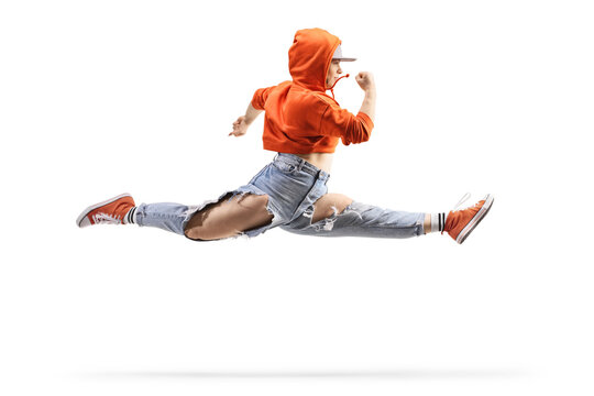 Female street dancer performing a split leap