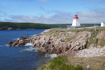 Fototapeta na wymiar Canadian lighthouse at Neils Harbor on the Cabot Trail in Cape Breton, Nova Scotia