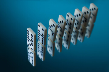 board logic game for the whole family and friends of dominoes. light-colored dominoes with black...