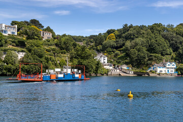 View from Fowey of the Bodinnick Ferry about to arrive in Bodinnick. On the right is Ferryside,...