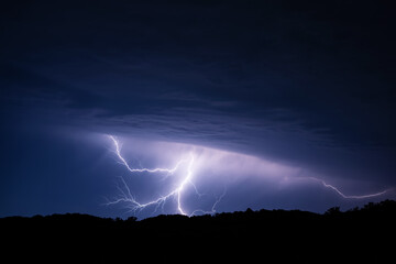 Naklejka na ściany i meble A thunderstorm front with branched lightning