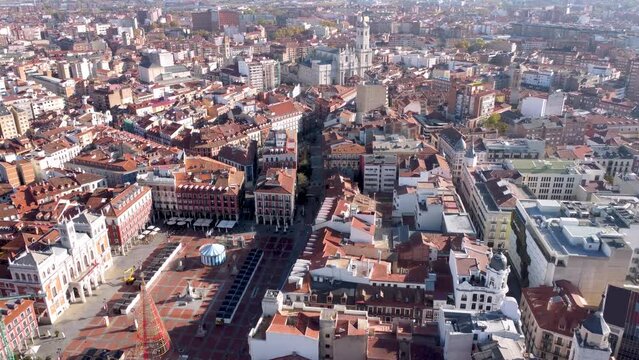 European city Valladolid, perspective from above. Drone forward  View of the Cathedral of Valladolid and Plaza Mayor Square. Rooftop and city streets. Travel destination in Spain. Medieval city