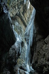 Fototapeta na wymiar Partnacklamm Gorge in Garmisch-Partenkirchen, Germany with ice hanging from the edge of cliffs