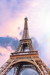 The Eiffel Tower in Paris against the backdrop of a beautiful evening sky.