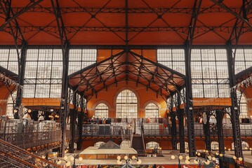 Interior of the Great Market Hall in Budapest, Hungary, while people shop