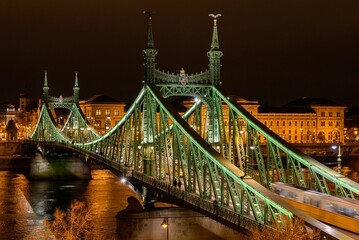 Aerial view of the illuminated Liberty bridge across the Danube river in Budapest, Hungary