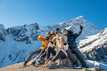 Obraz premium Group of friends posing for photo in Julian Alps in Slovenia