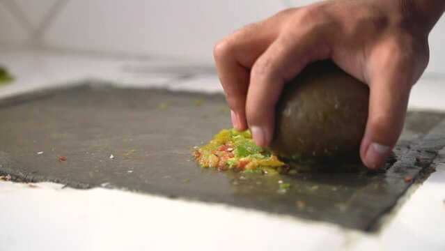 making bolivian llajua by hand and batan round