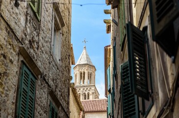 Narrow streets of Split, Croatia with view of St. Domnius cathedral bell tower