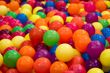 Fototapeta na wymiar Multi-colored children's balls. Lots of children's toys.