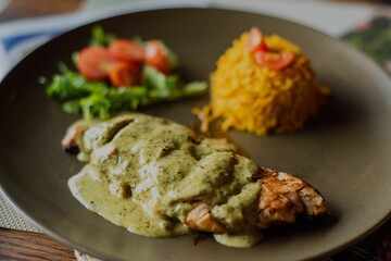Close-up of a dinner served on a brown plate - restaurant dish concept