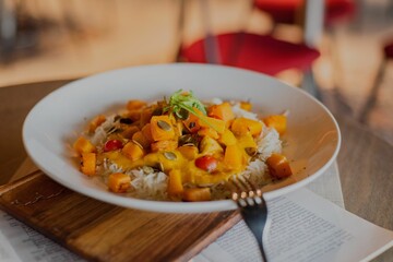 Close-up of Sweet Potato Curry dish served on a white plate - restaurant dish concept