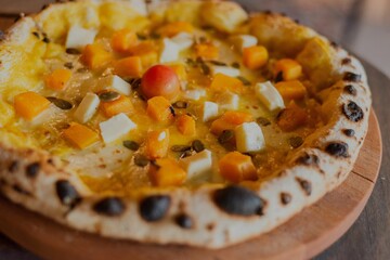 Closeup of pumpkin pizza on the table
