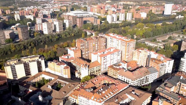 Aerial perspective of Valladolid city. Situated in Spain, in Castilla y Leon Province. View of River Pisuerga and La Rosaleda Park. Drone forward. Beautiful panorama of whole city. 