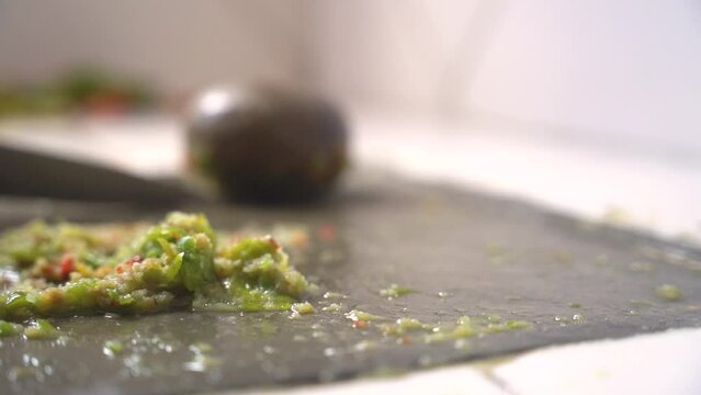 making Bolivian llajua with round batan in slow motion