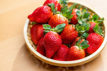 Freshly picked strawberries nestled in a cozy basket