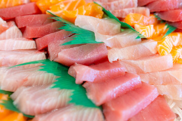 Variety of sashimi in plastic box