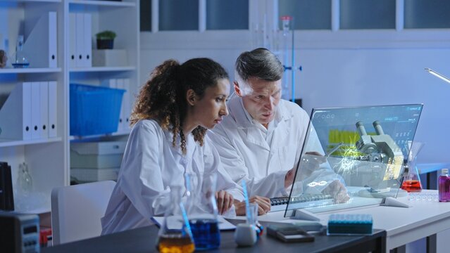Bacteriology laboratory scientist conducting research using advanced computer technology