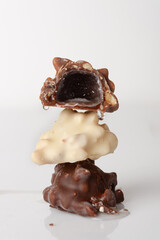 chocolates with cognac, selective focus, on white glass