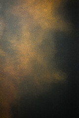 Dark brown grunge background with imitation of rust on metal. Free space for text. Vertical photo. Top view.