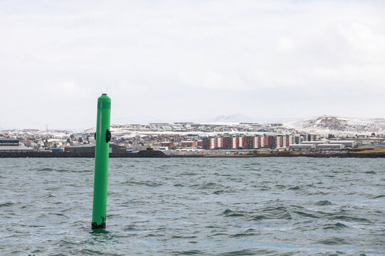 Port hand green spar buoy with light on top. Navigation equipment