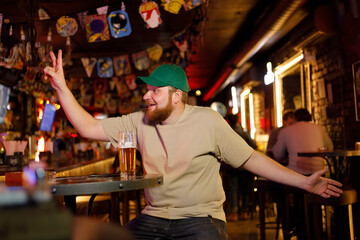 Laughing Man At The Bar Having A good Time Drinking Alcohol