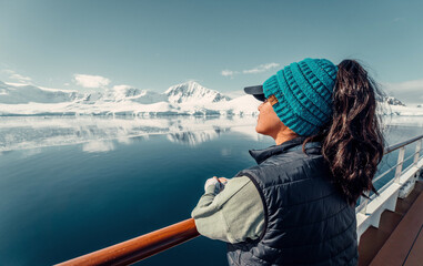 Female Tourist On Luxury Antarctica Cruise Ship Looking Out At The Stunning Scenic Arctic Landscape, landscape Shot, Young Woman