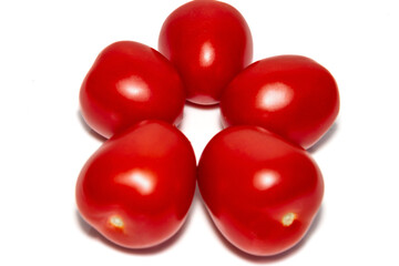 Five red ripe tomatoes in front of white background. Close-up. Beautiful red ripe tomatoes.