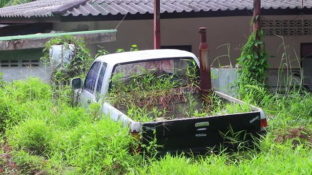 Scrap cars wrecks rotting in the bushes on Phuket Thailand.