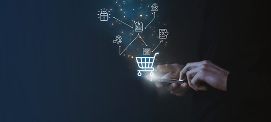 Shopping online payment concept. Man hand using smart phone with cart delivery icon, banking and online shopping via banking mobile app, E-transaction and financial technology