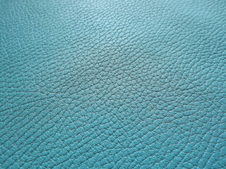 Genuine leather and genuine suede turquoise blue close-up as background