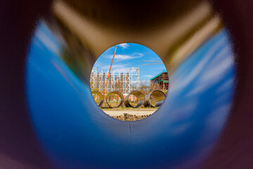 Look through stone pipes with resistant glaze placed on the ground in front construction site